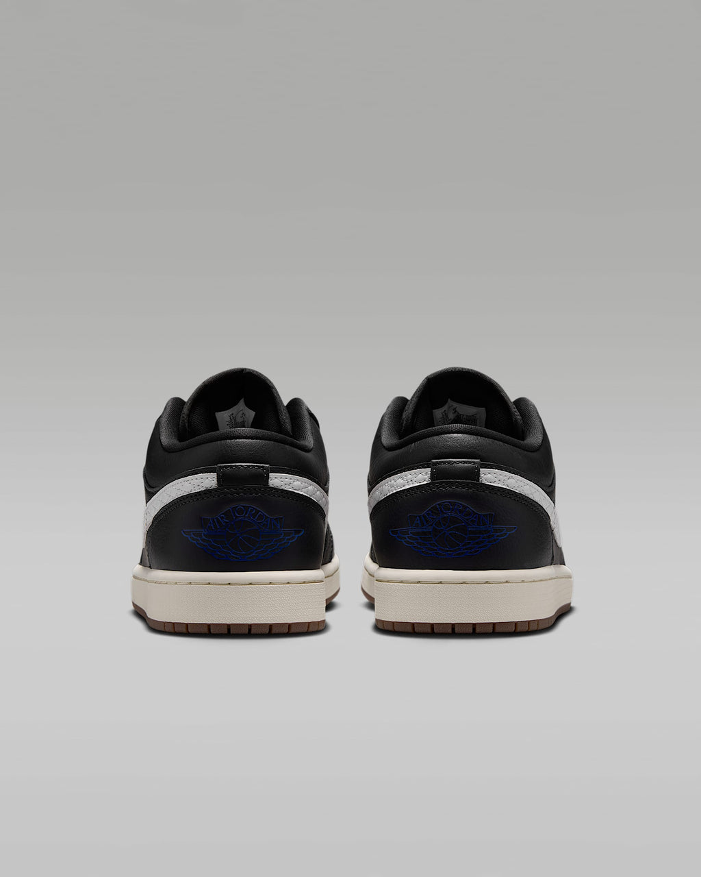 Air Jordan 1 Low Black White Quilted Swoosh Gum Outsole Leather Sneakers