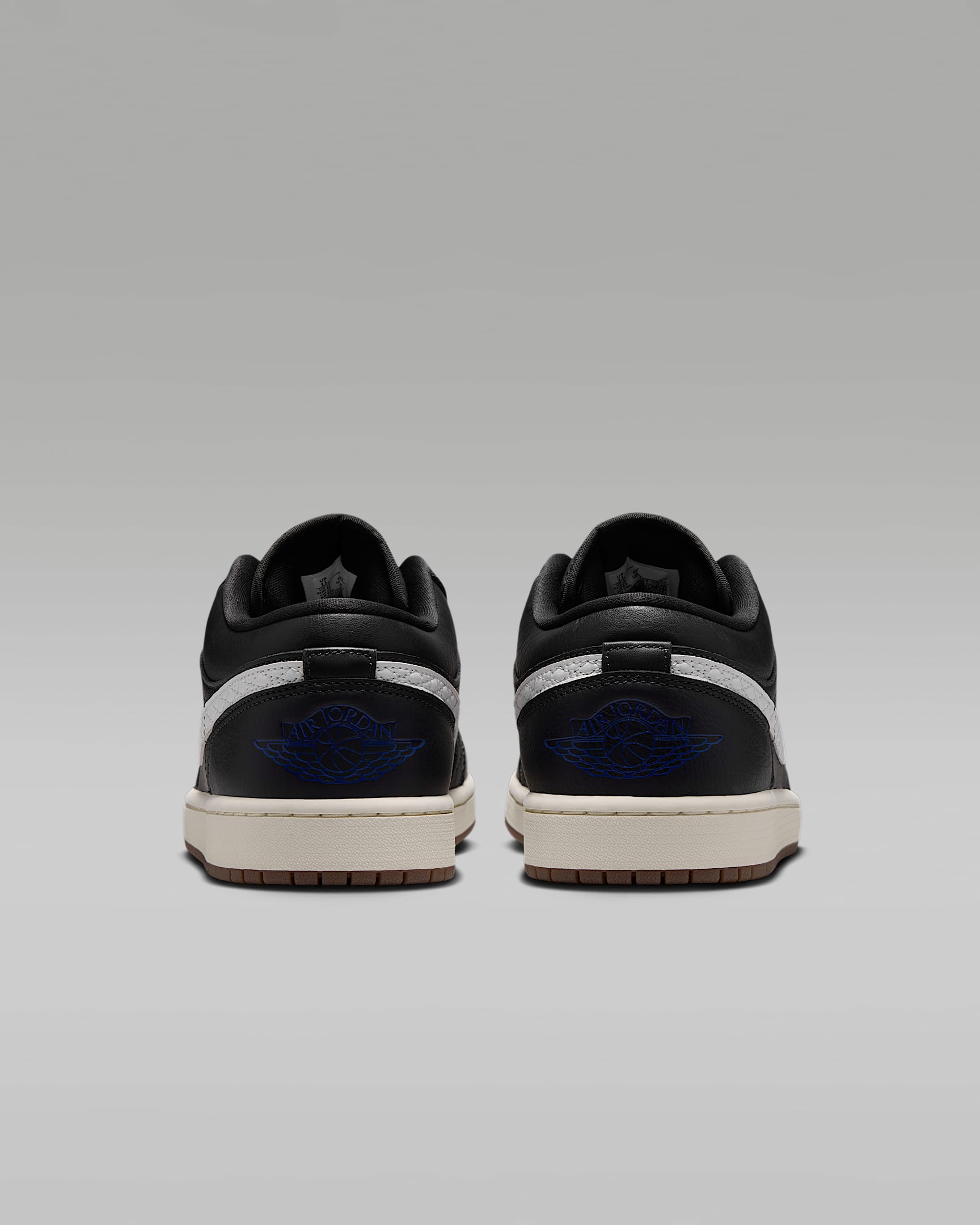 Air Jordan 1 Low Black White Quilted Swoosh Gum Outsole Leather Sneakers